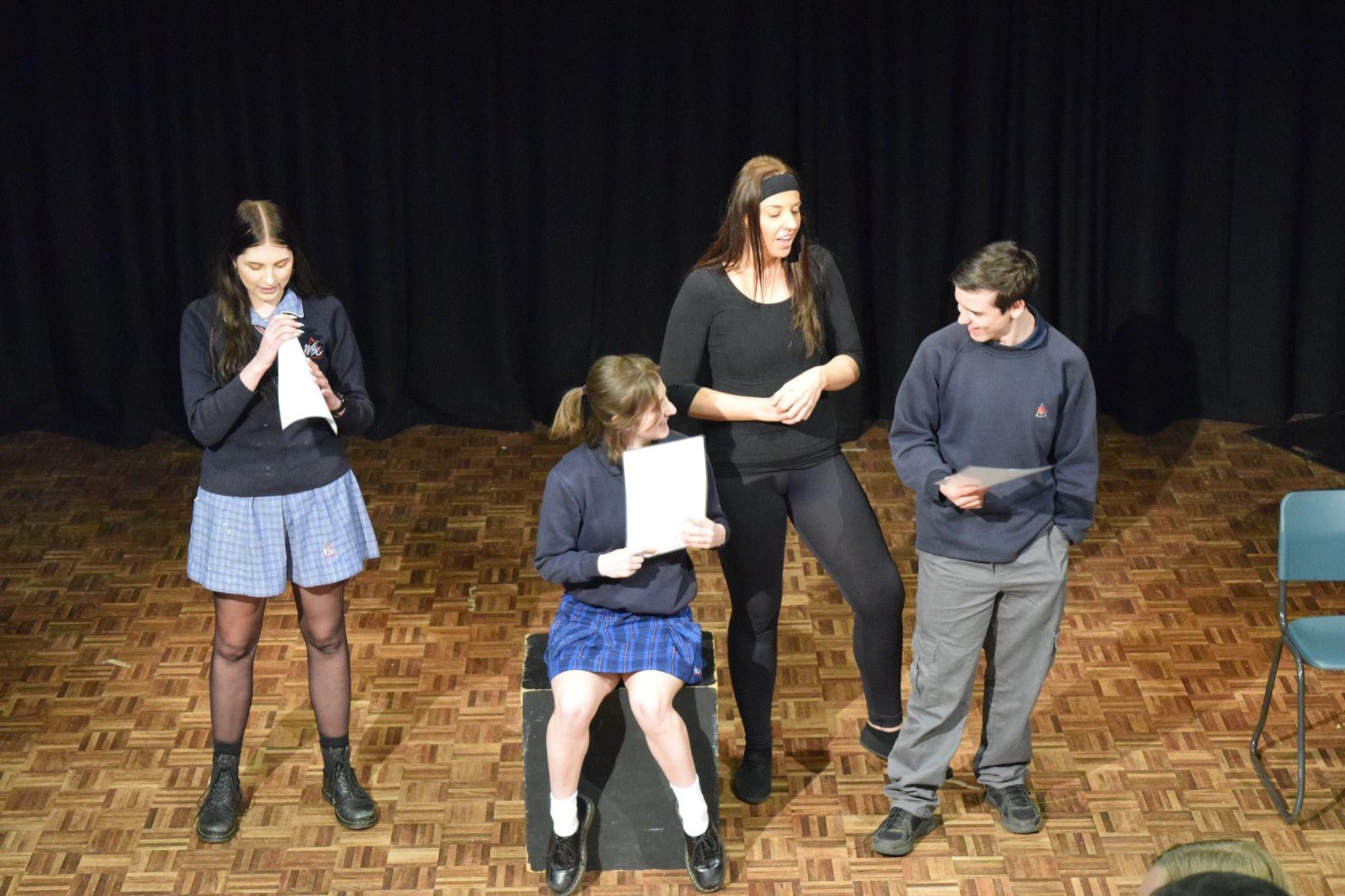 Ally running the Self-Talk workshop with student volunteers on stage